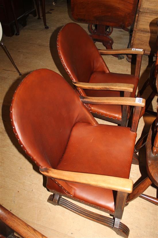 Two armchairs with leather seats and backs